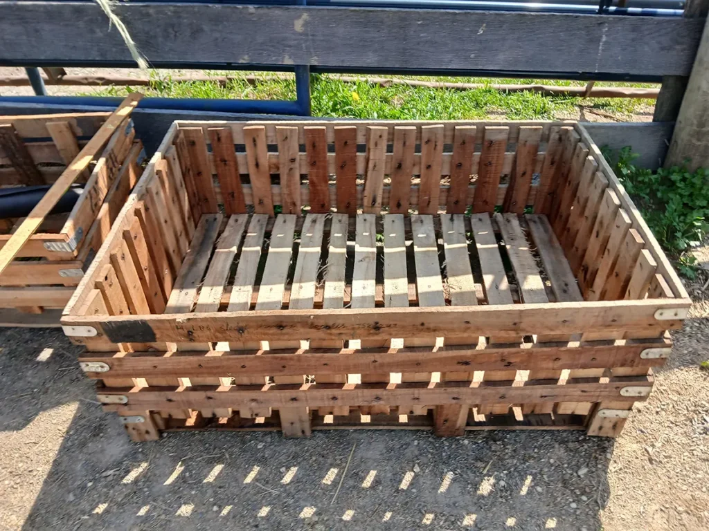 Wooden crate used as a horse herb garden planter before adding soil and plants