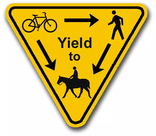 Trail etiquette with horses courtesy sign.
